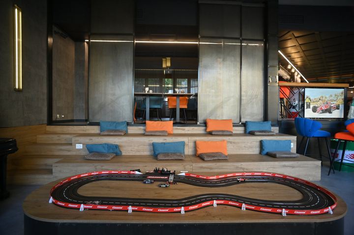 Seating and slot car track in the lobby of Admiral Hotel Milano